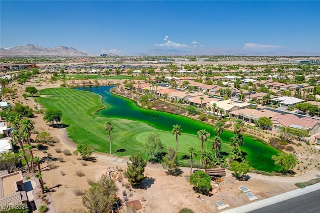 birds eye view of property featuring a water and mountain view