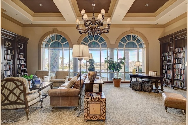 sitting room with a towering ceiling, light colored carpet, a notable chandelier, and ornamental molding