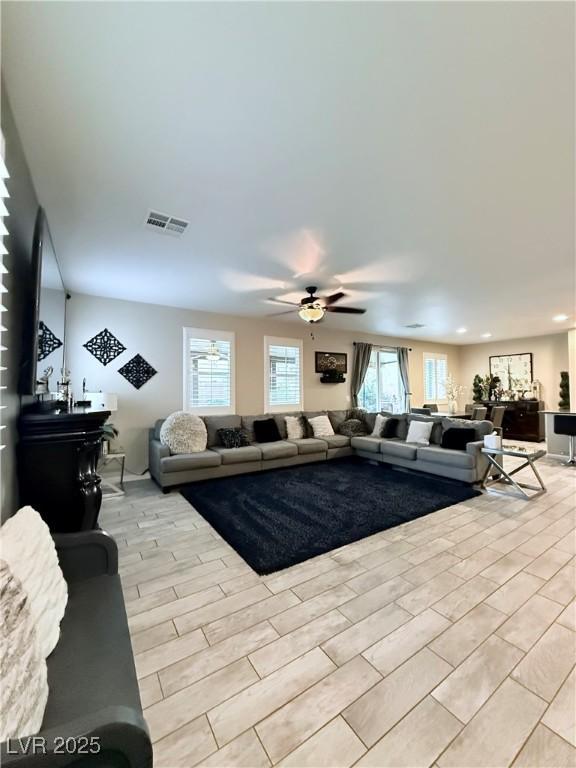 living room with ceiling fan