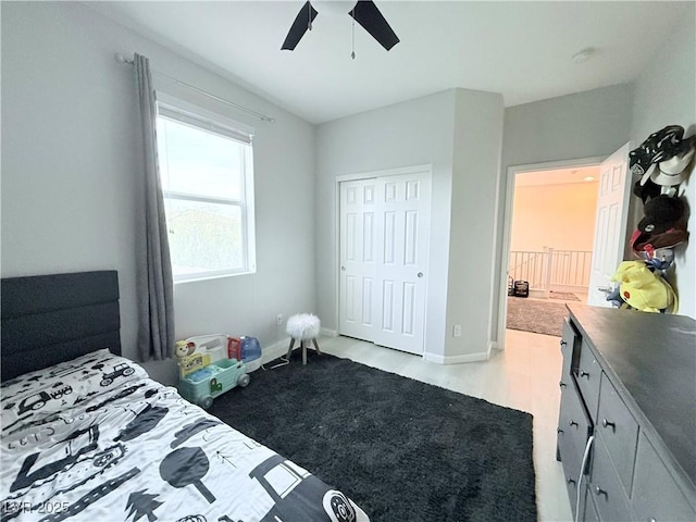 bedroom with a closet, ceiling fan, and light hardwood / wood-style flooring