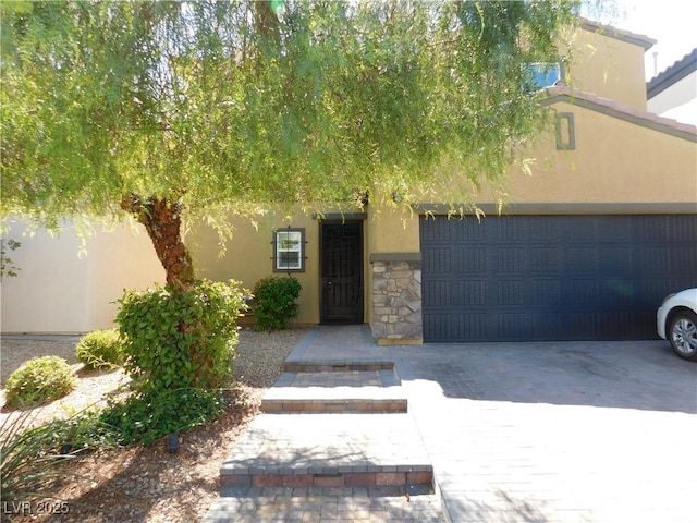 view of exterior entry featuring a garage