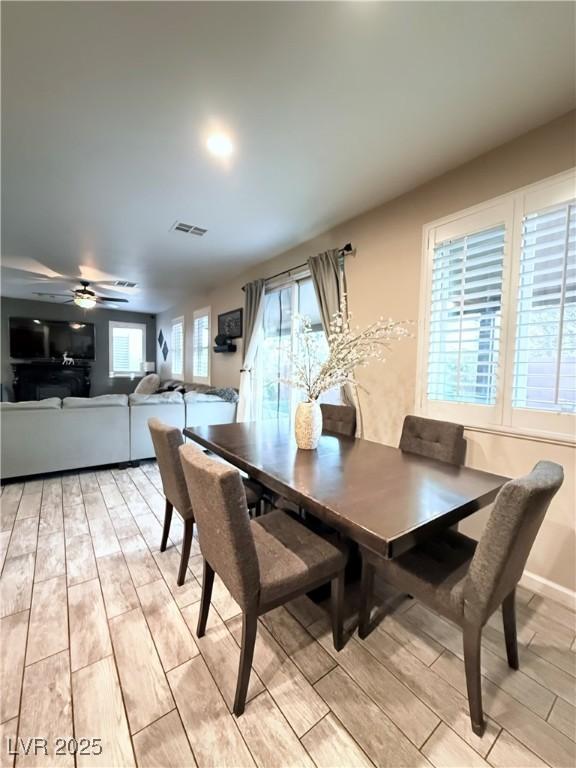 dining room featuring ceiling fan