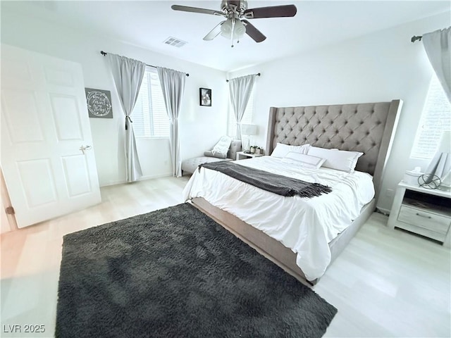 bedroom with light wood-type flooring and ceiling fan