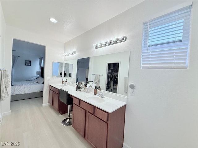 bathroom with wood-type flooring and vanity