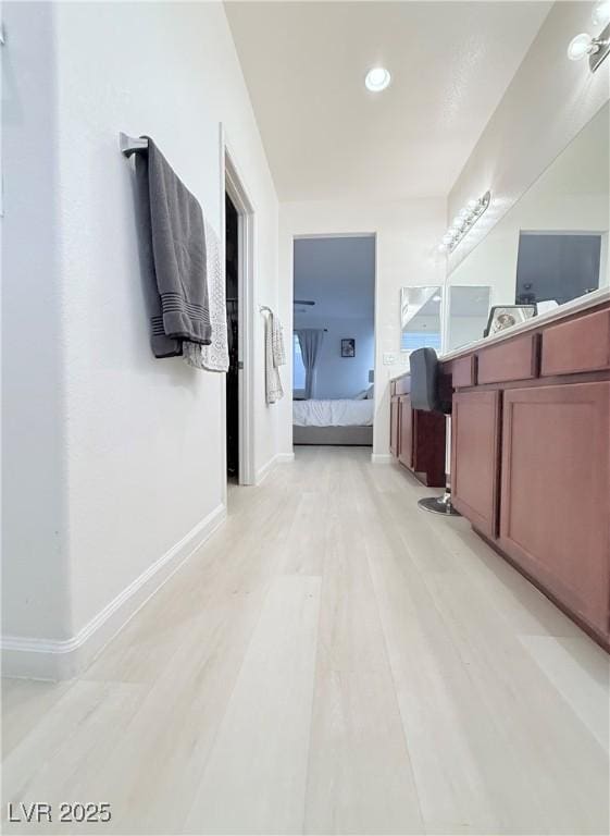 bathroom featuring hardwood / wood-style flooring and vanity