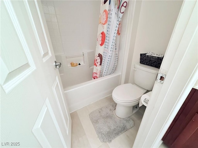 bathroom featuring shower / bathtub combination with curtain and toilet