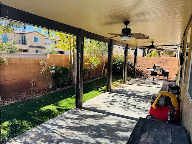 view of patio featuring ceiling fan