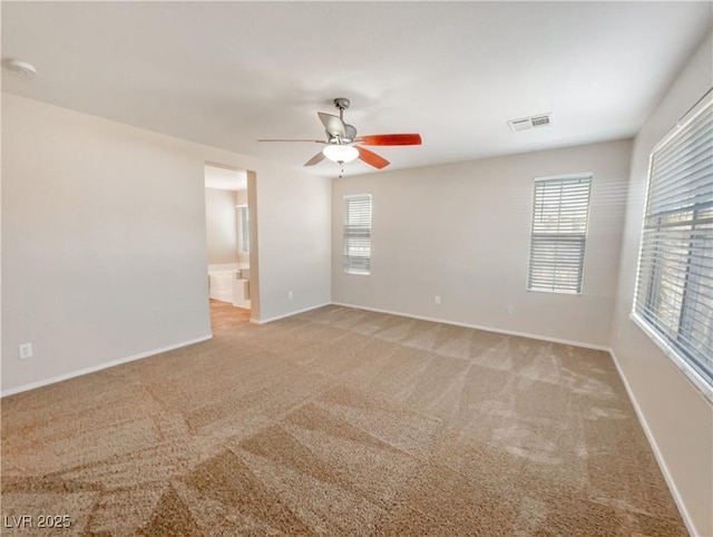 carpeted empty room with ceiling fan