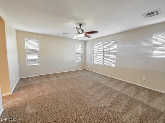 spare room with carpet flooring and ceiling fan