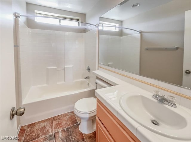 full bathroom featuring plenty of natural light, toilet, vanity, and bathtub / shower combination