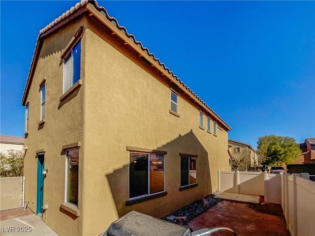 rear view of house featuring a patio