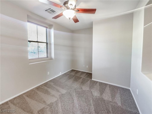 carpeted spare room featuring ceiling fan