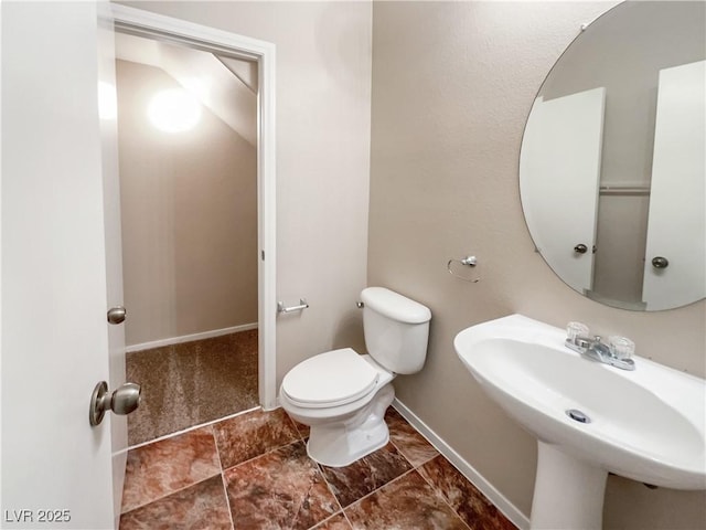 bathroom with toilet and sink