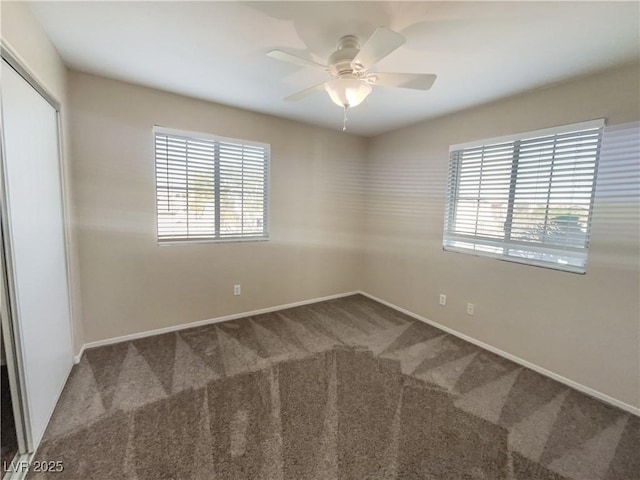 unfurnished room featuring carpet and ceiling fan