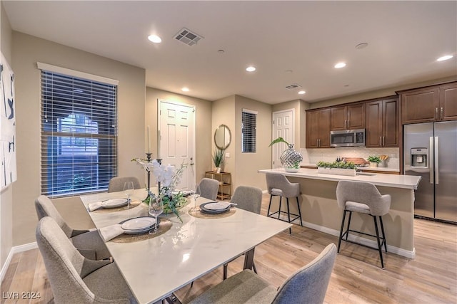 dining room featuring light hardwood / wood-style floors