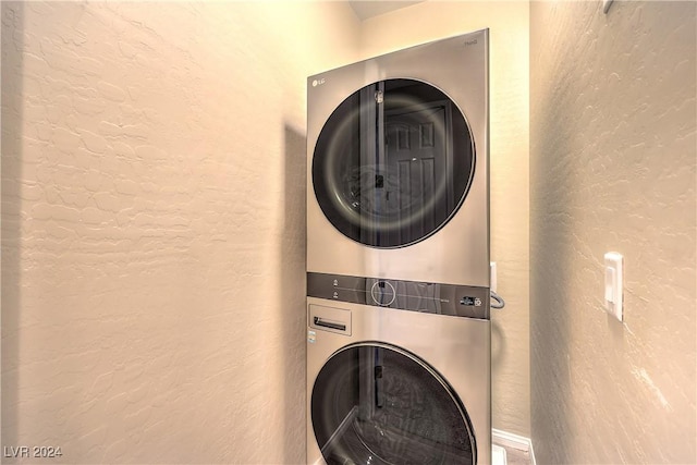 laundry room featuring stacked washer and clothes dryer