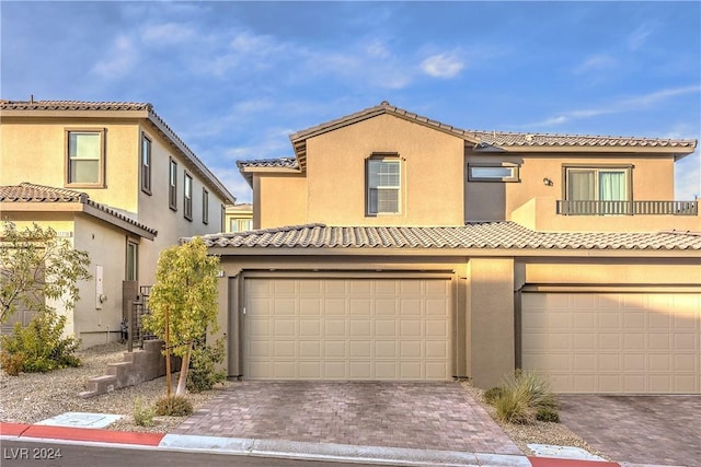 mediterranean / spanish-style home featuring a garage