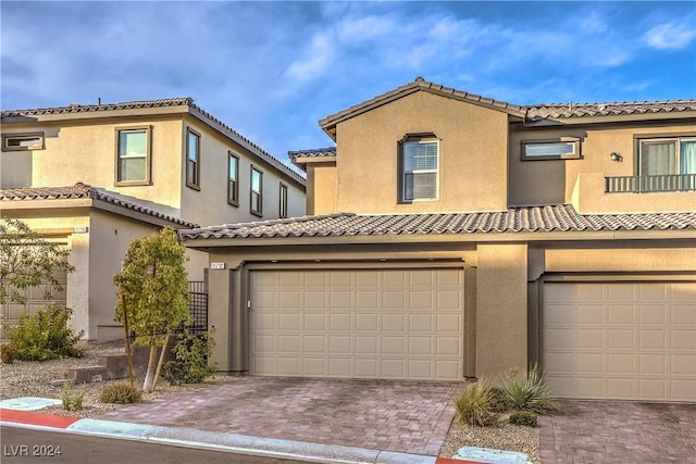 mediterranean / spanish-style home featuring a garage