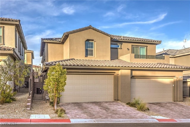 mediterranean / spanish-style home featuring a garage