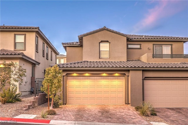 mediterranean / spanish-style house featuring a garage