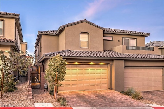 mediterranean / spanish-style house featuring a garage