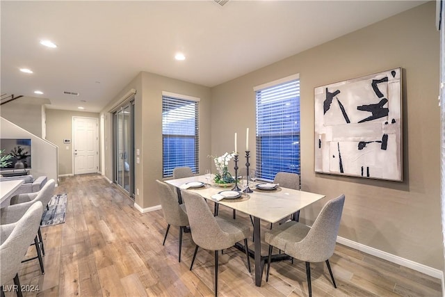 dining room with light wood-type flooring