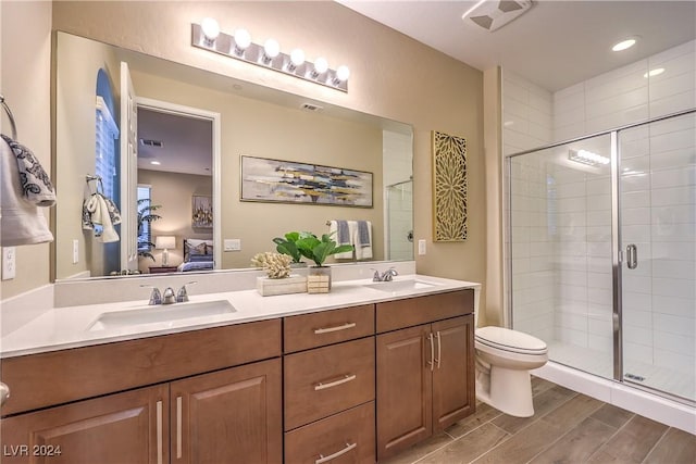 bathroom with vanity, toilet, and walk in shower