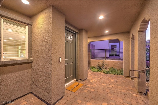 property entrance with a patio area