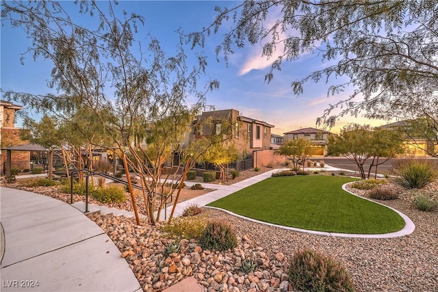 view of yard at dusk