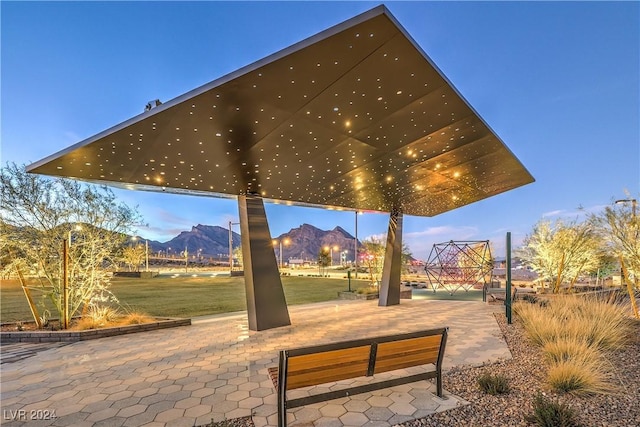 surrounding community featuring a mountain view and a yard