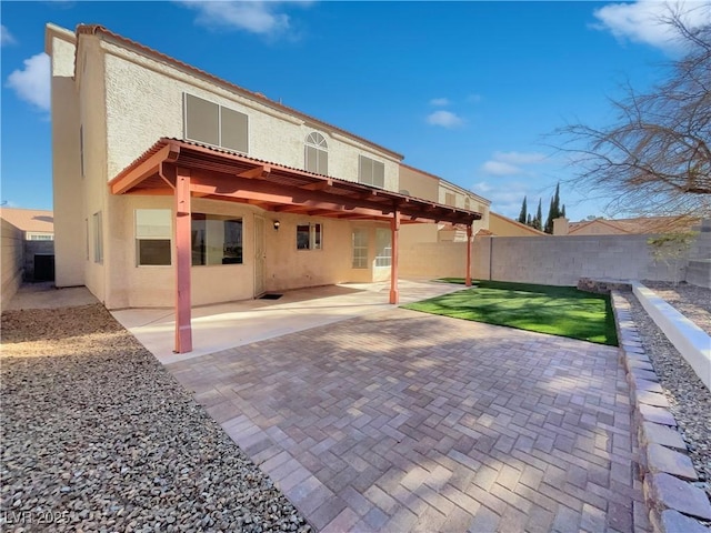 rear view of property with a patio area