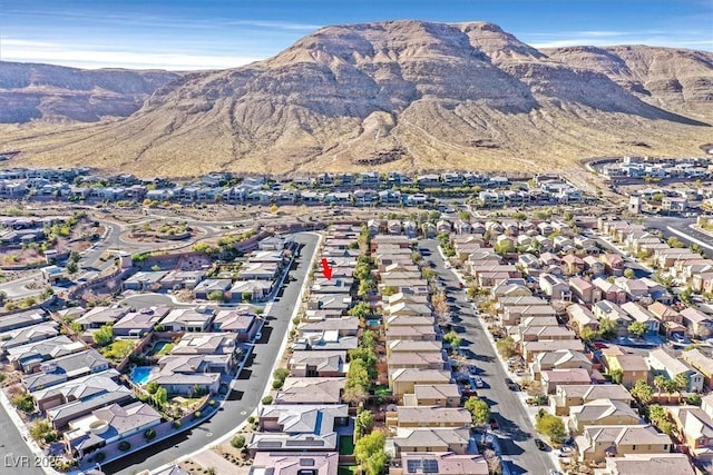 birds eye view of property with a mountain view