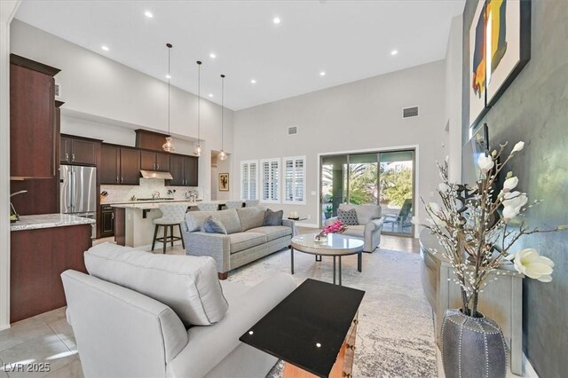 living room with a high ceiling