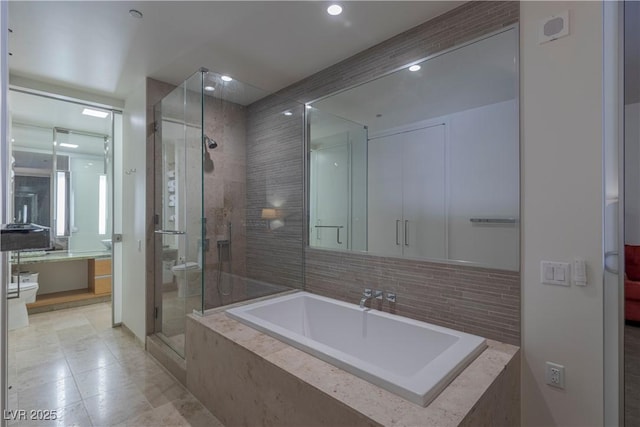 bathroom with toilet and a shower with shower door