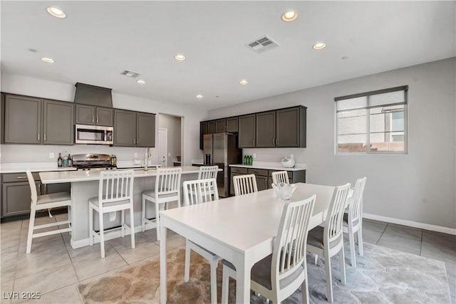 tiled dining space with sink