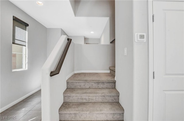 stairway with tile patterned flooring