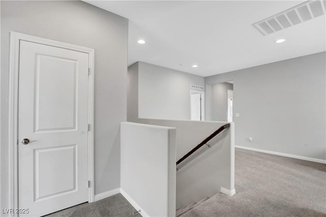 hallway with carpet floors