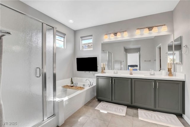 bathroom featuring tile patterned floors, vanity, and plus walk in shower