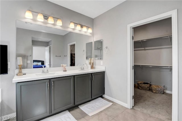 bathroom featuring tile patterned flooring and vanity