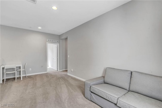 sitting room with carpet floors