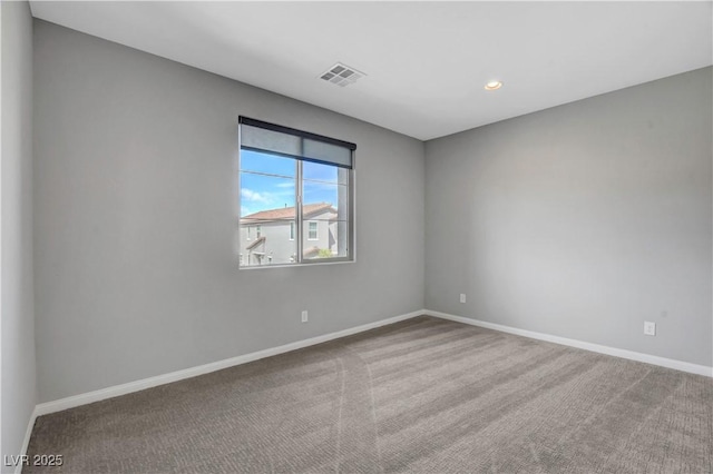 spare room featuring carpet flooring