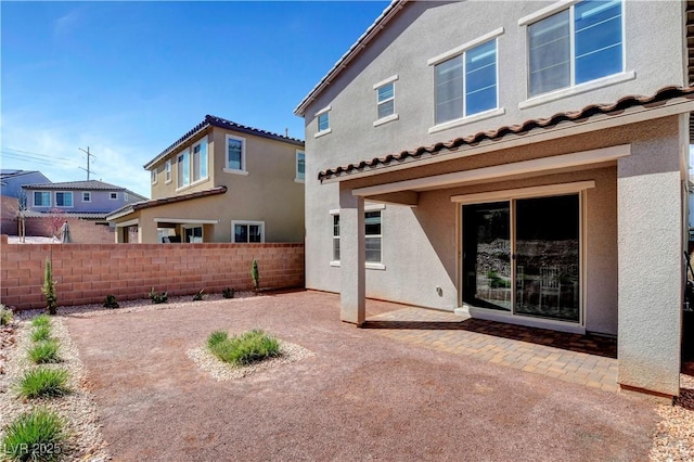 back of property with a patio area