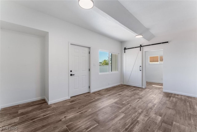 entrance foyer featuring hardwood / wood-style floors and a barn door