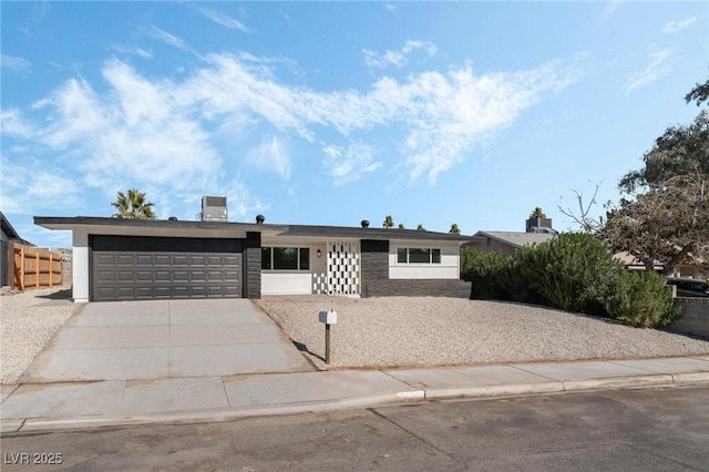 ranch-style home featuring a garage