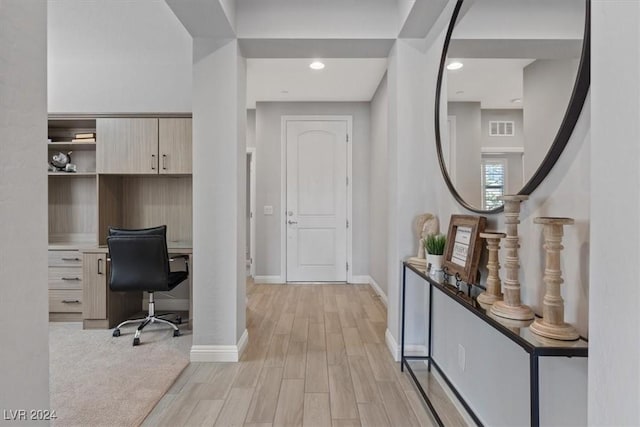 office space with light wood-type flooring