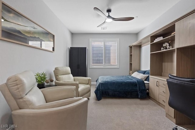 bedroom with ceiling fan and light colored carpet