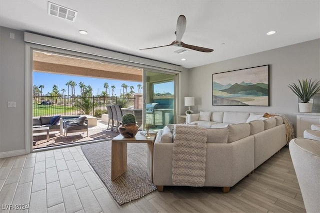 living room with ceiling fan