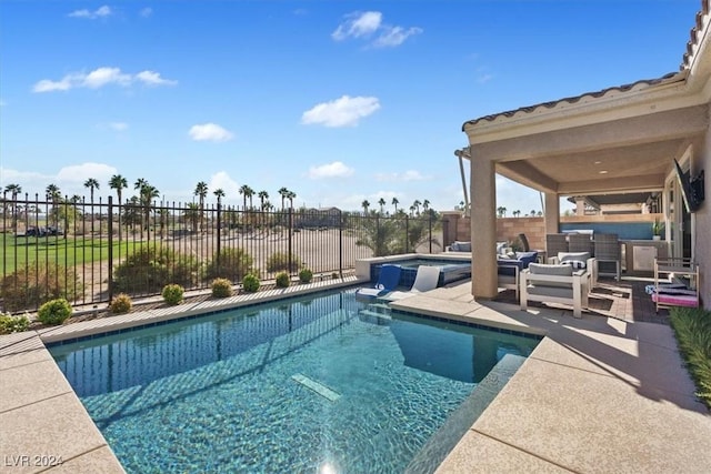 view of pool with a jacuzzi and a patio