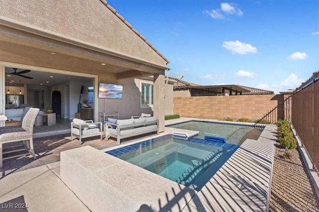 view of pool with an in ground hot tub, an outdoor living space, and a patio