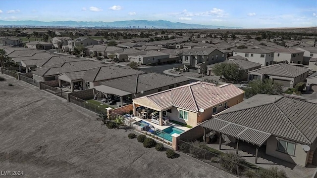 birds eye view of property featuring a mountain view